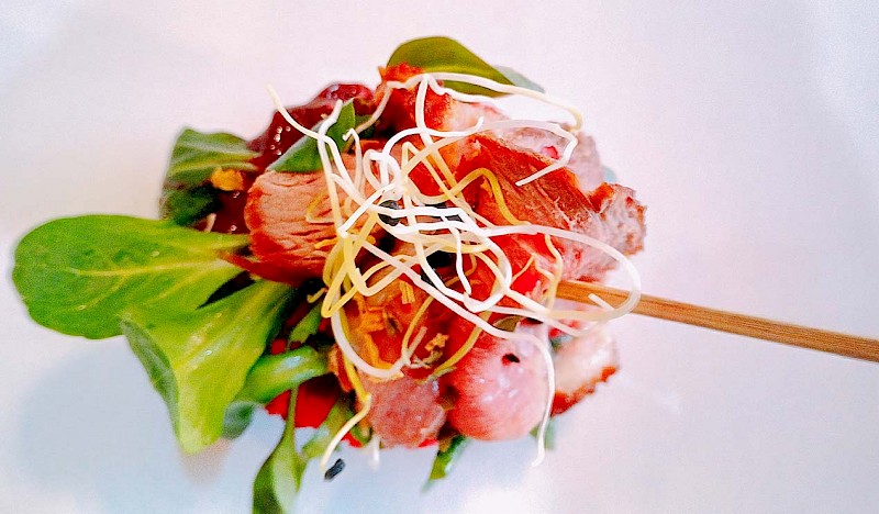 Medium rare duck breast with sour cherry cream on a crispy cracker - Dida Boža